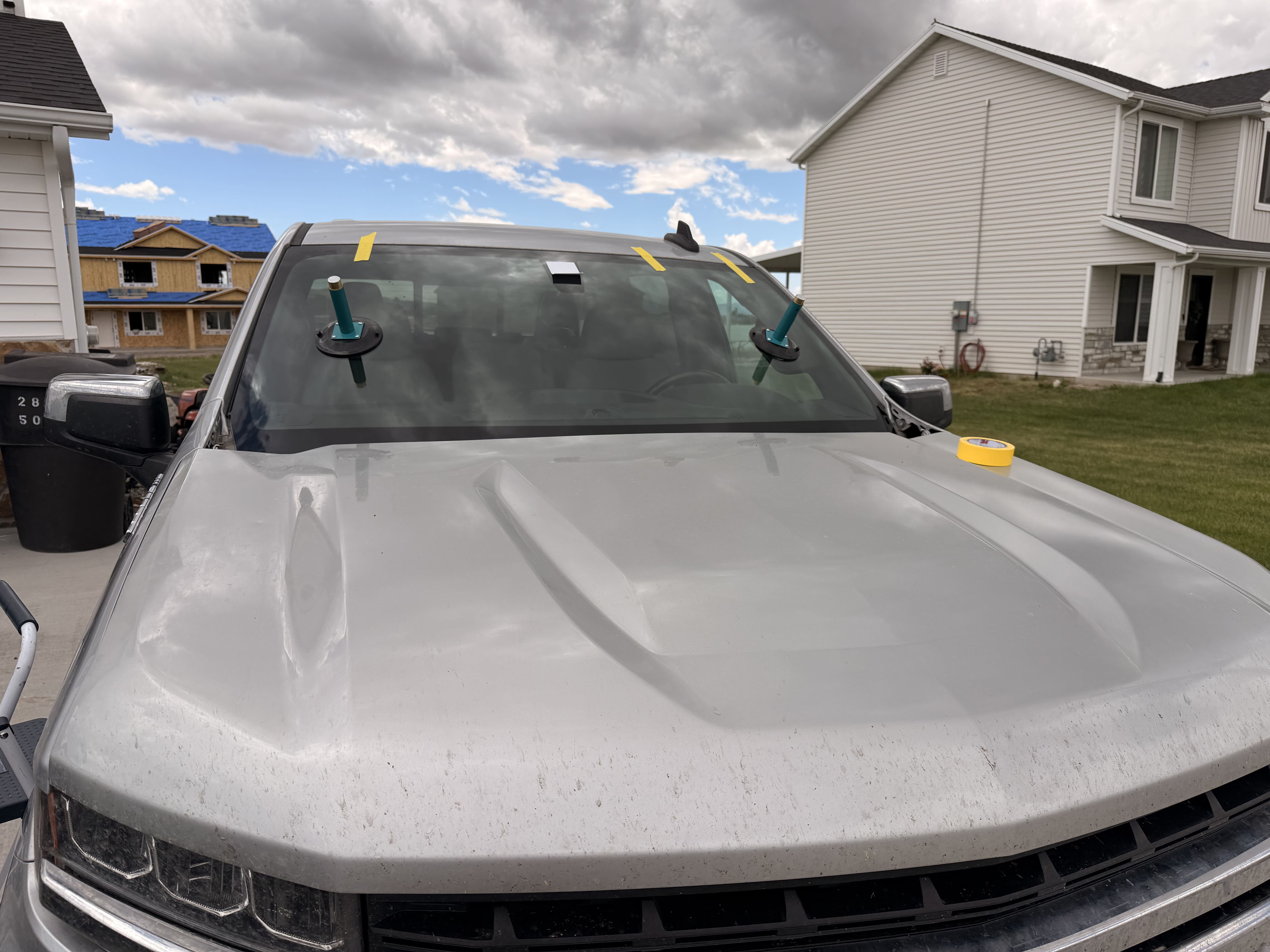 Windshield replacement being prepared on a pickup truck