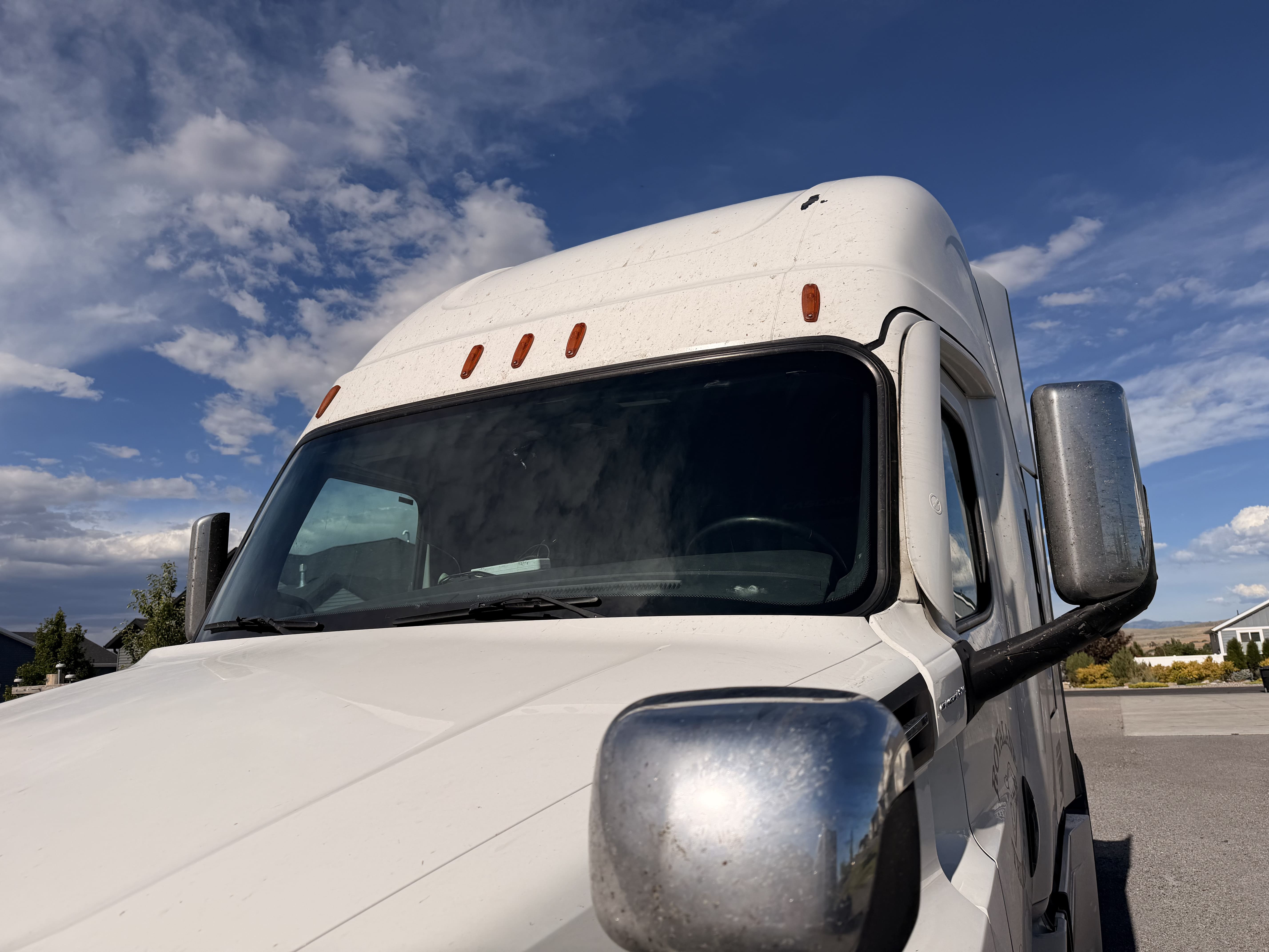 Commercial truck with a serviced front windshield